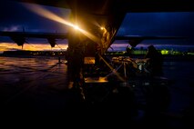 Airmen off load weapon.
