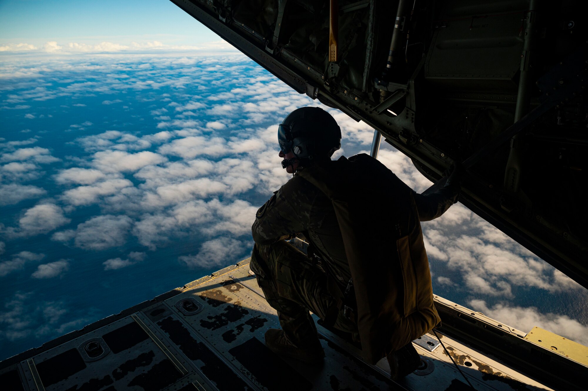 Airman looks out over ocean.
