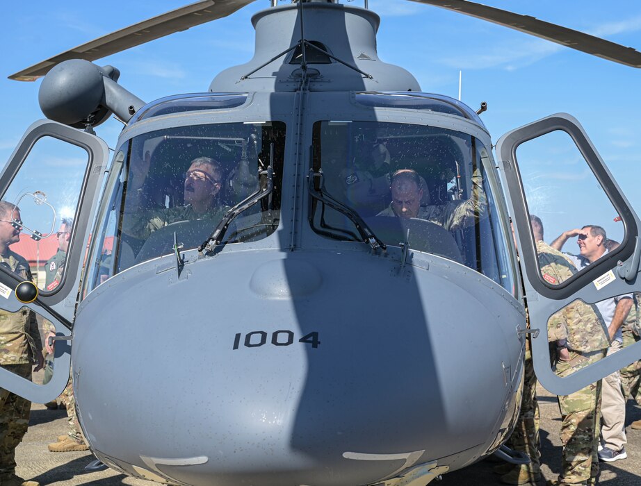 commanders observe a helicopter cockpit