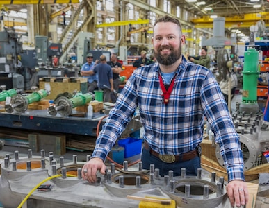 Britton Cox, mechanical engineer, Code 260M, Inside Machine Shop Engineering & Planning, poses for a portrait in Building 431 at Puget Sound Naval Shipyard & Intermediate
Maintenance Facility, in Bremerton, Washington. (U.S. Navy photo by Wendy Hallmark)