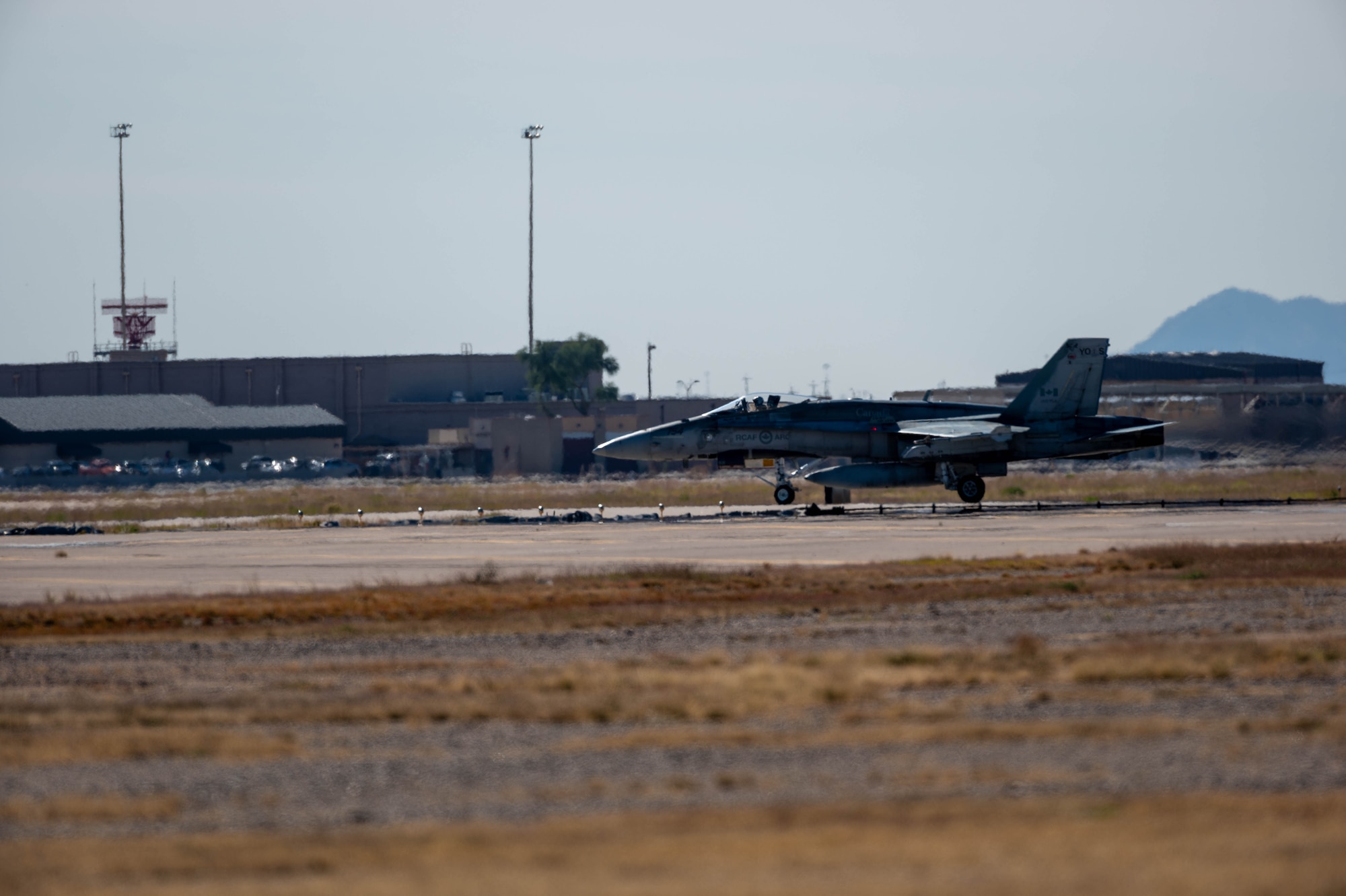 A Royal Canadian Air Force CF-18 Hornet aircraft from the 401 Tactical Fighter Squadron taxis after landing Nov. 17, 2022, at Luke Air Force Base, Arizona.