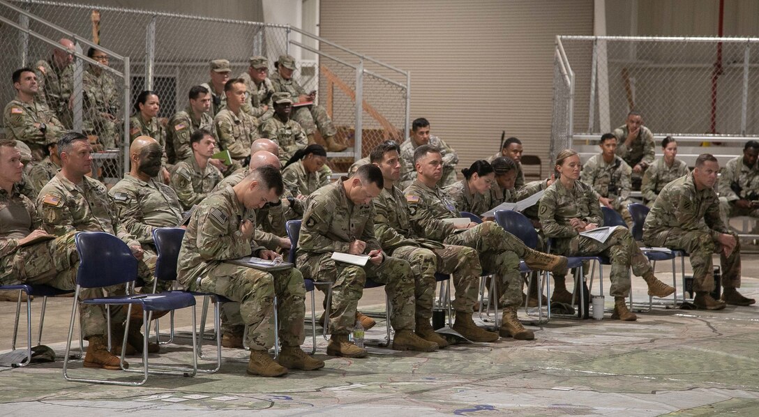 U.S. Army Soldiers with 2nd Infantry Brigade Combat Team, 25th Infantry Division, receive a sustainment brief during brigade rehearsals on Wheeler Army Airfield, HI, Oct. 29, 2022. The Joint Pacific Multinational Readiness Center (JPMRC) training strongly contributes to our readiness in the most consequential region in the world at the most consequential times in history during rotation 23-01. JPMRC strengthens defense relationships, fosters multinational interoperability, increases readiness, and reinforces the unified regional land power network of the Joint Force. (U.S. Army photos by Spc. Jeffrey Garland)