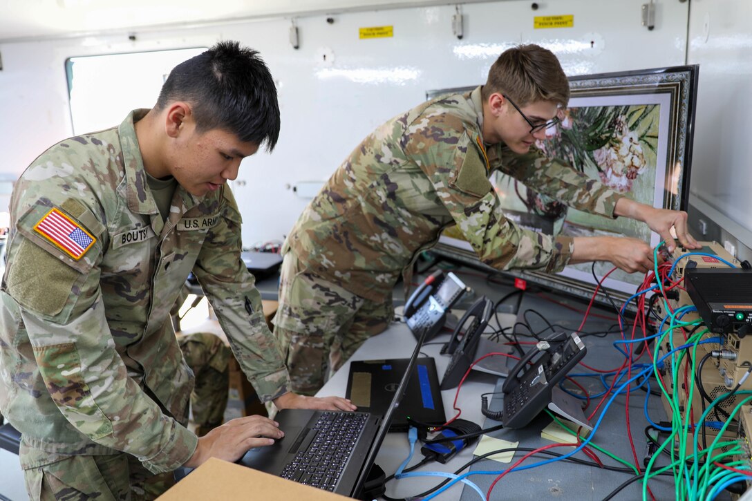 From left, U.S. Army Spc. Patrick Boutsy and Pfc. Kevin Brown conduct maintenance for communications equipment during the annual joint bilateral exercise Keen Sword, Nov. 12, 2022.  Exercises like Keen Sword is an ideal training scenario for Soldiers allowing U.S. military forces to work with Japanese forces across a variety of areas to enhance the already broad interoperability of U.S. and Japanese forces.Keen Sword is the latest in a series of joint-bilateral field training exercises designed to increase combat readiness and interoperability of the JSDF and U.S. forces. The U.S.-Japan Alliance is built on shared interests and values, and a commitment to freedom and human rights. The alliance is strong and focused on reinforcing a security architecture of regional partnerships, including building new partnerships and strengthening multilateral cooperation.(U.S. Army Reserve photo by Sgt. Teresa Cantero)