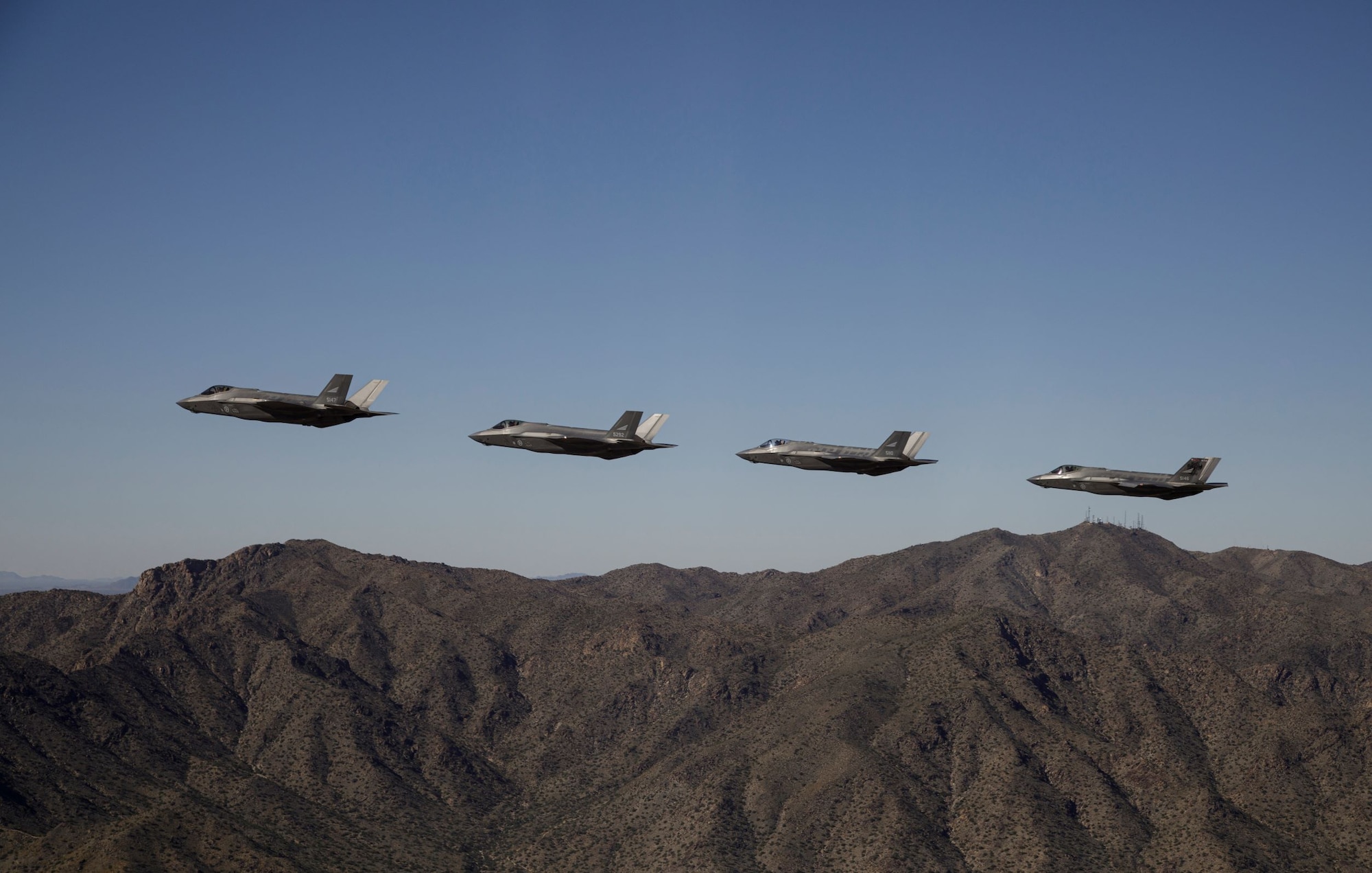 Four Royal Norwegian Air Force F-35 Lightning II aircraft fly in formation