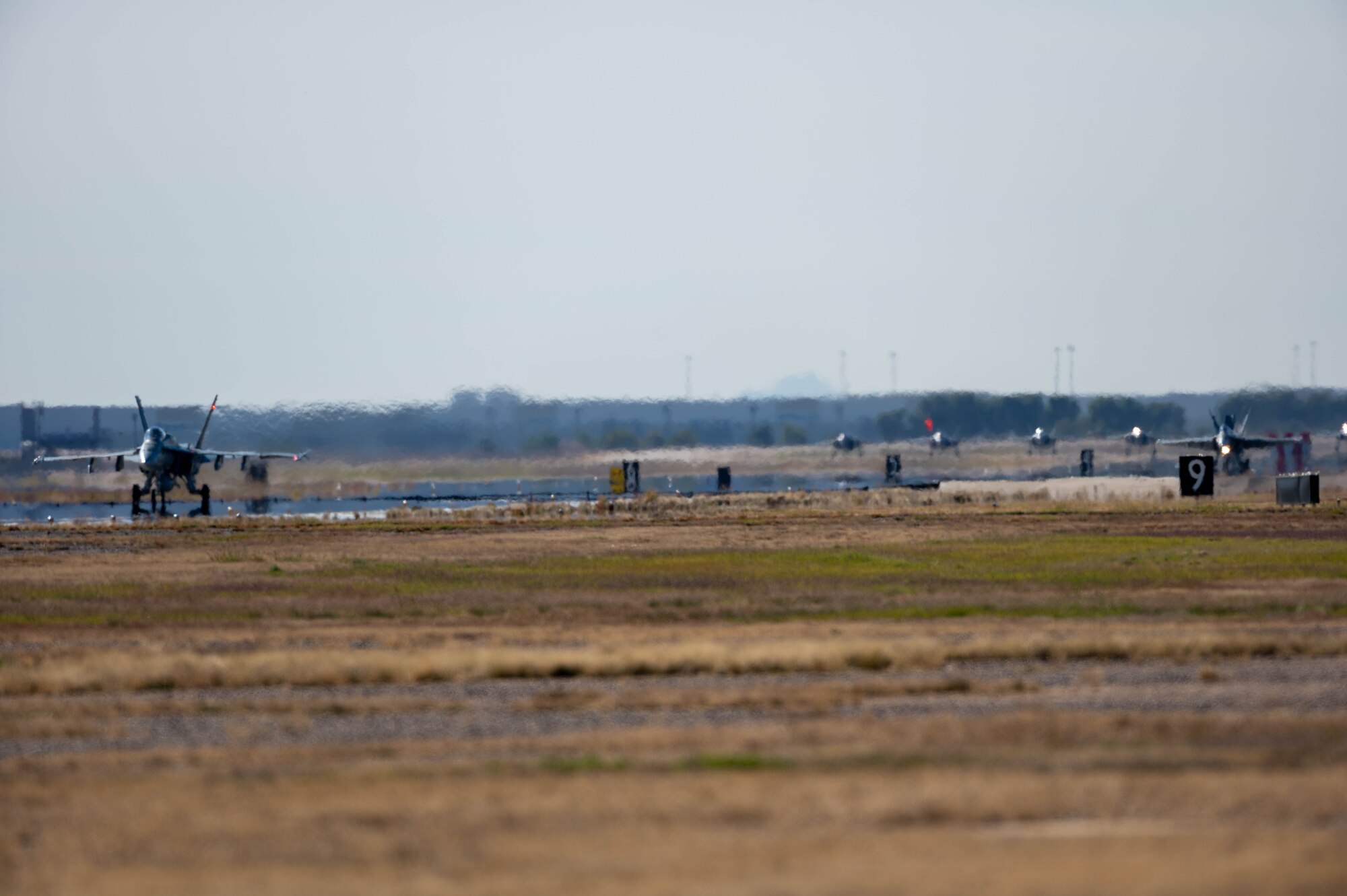 Royal Canadian Air Force  CF-18 Hornet aircraft from the 401 Tactical Fighter Squadron taxi after landing Nov. 17, 2022, at Luke Air Force Base, Arizona.
