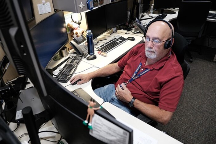 man works on computer in office