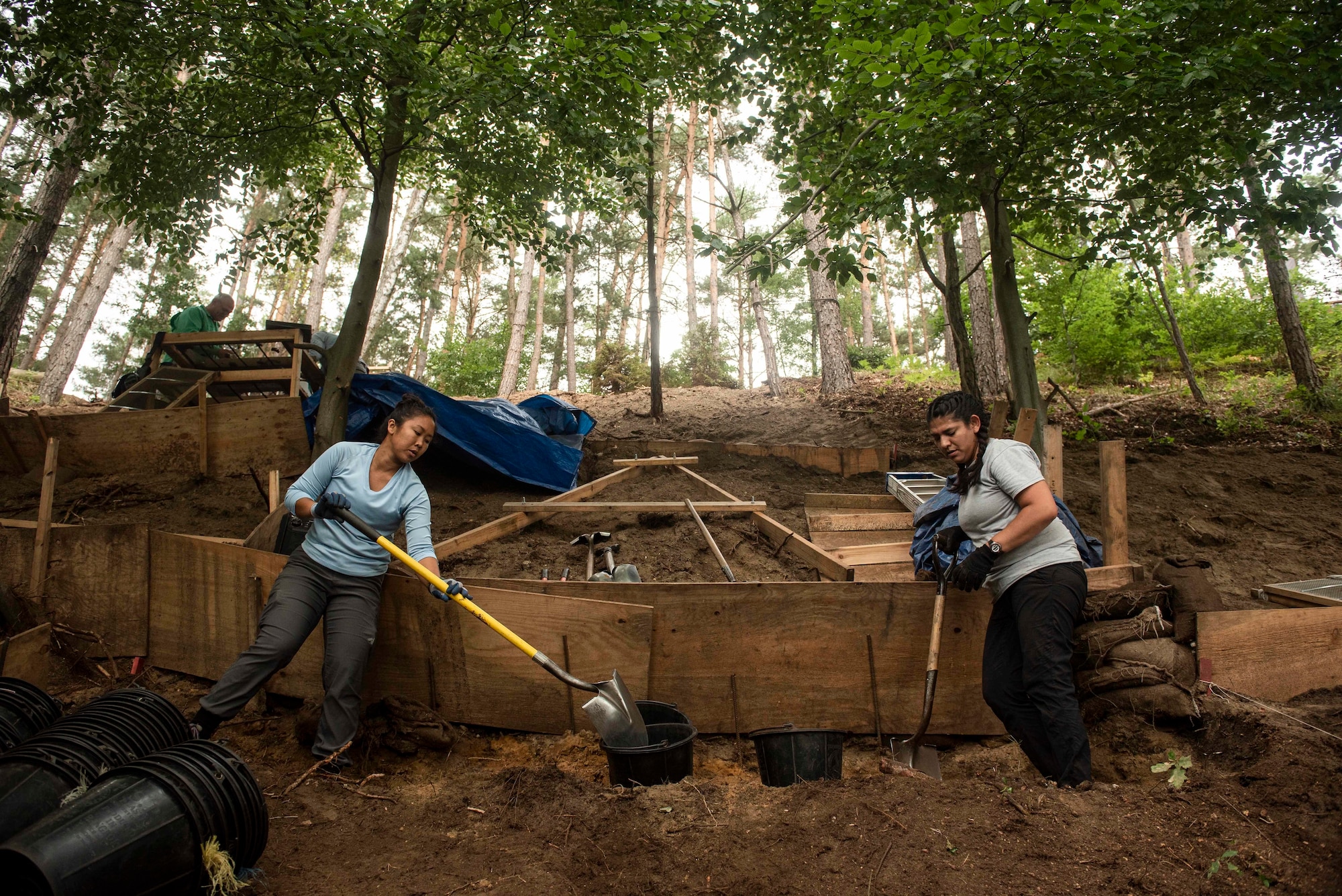 individuals shoveling to find the missing