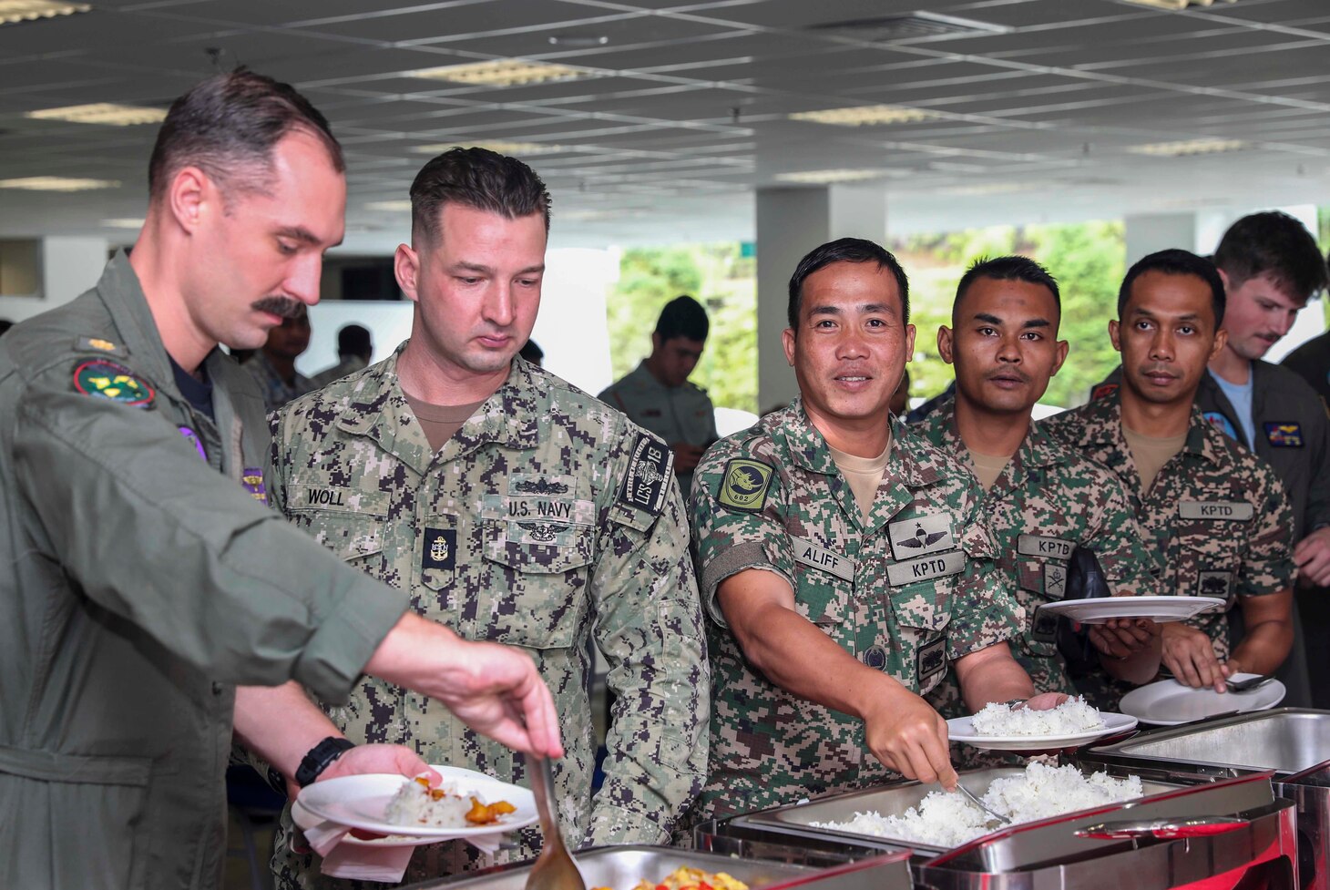 221121-N-FO714-1173 KUANTAN, Malaysia (Nov. 21, 2022) U.S. and Malaysian Armed Forces service members attend a reception after the opening ceremony for exercise Cooperation Afloat Readiness and Training (CARAT) Malaysia, Nov. 21. CARAT Malaysia 2022 highlights the 28th anniversary of CARAT among Allies and partners as a way to demonstrate long-term commitment to strengthened relationships throughout South and Southeast Asia and to highlight U.S. Navy commitment to key Association of Southeast Asian Nations (ASEAN) partners to reinforce ASEAN Centrality. Exercises like this one reassure our Allies and partners of the U.S. commitment to maintaining a free and open Indo-Pacific. (U.S. Navy photo by Mass Communication Specialist 1st Class Deanna C. Gonzales)