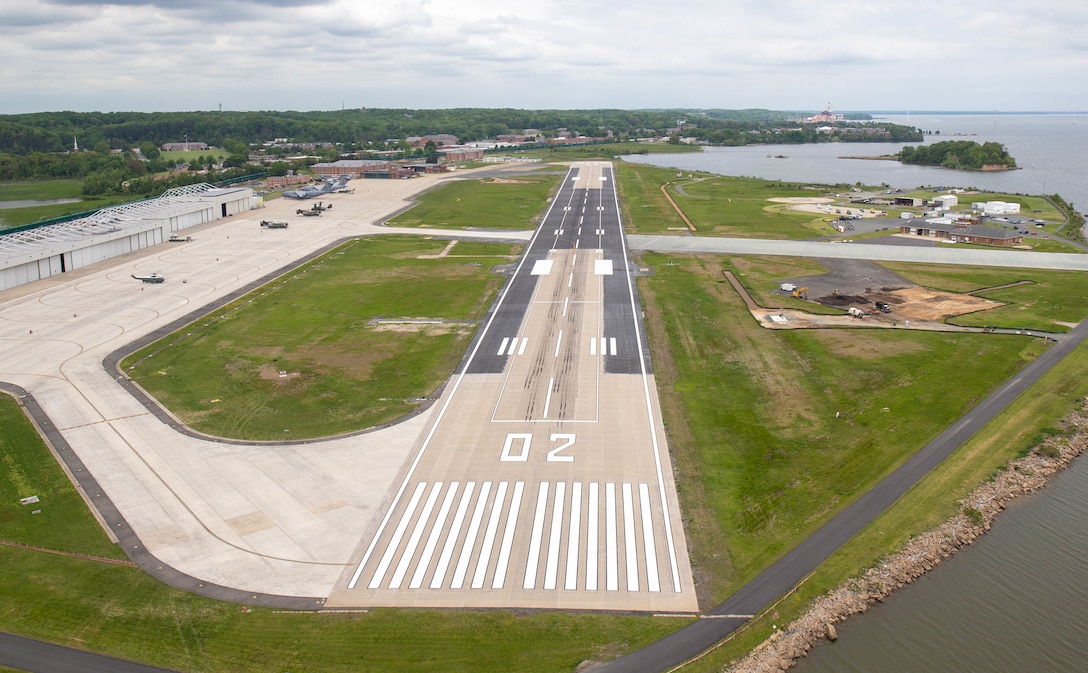 An aerial view of the renovated runway at Marine Corps Air Facility (MCAF), Marine Corps Base Quantico, Virginia, May 5, 2022. The large-scale runway repair project replaced old materials that either expired or were deemed outdated for use, with new and current materials. The updates to the runway included
concrete slab repairs and section replacements, asphalt repaving, and updated signage. The mission of MCAF is to operate and maintain the air facilities and provide services and material support to Marine Helicopter Squadron One and other transient aircraft. (U.S. Marine Corps photo by Cpl. Mitchell Johnson)