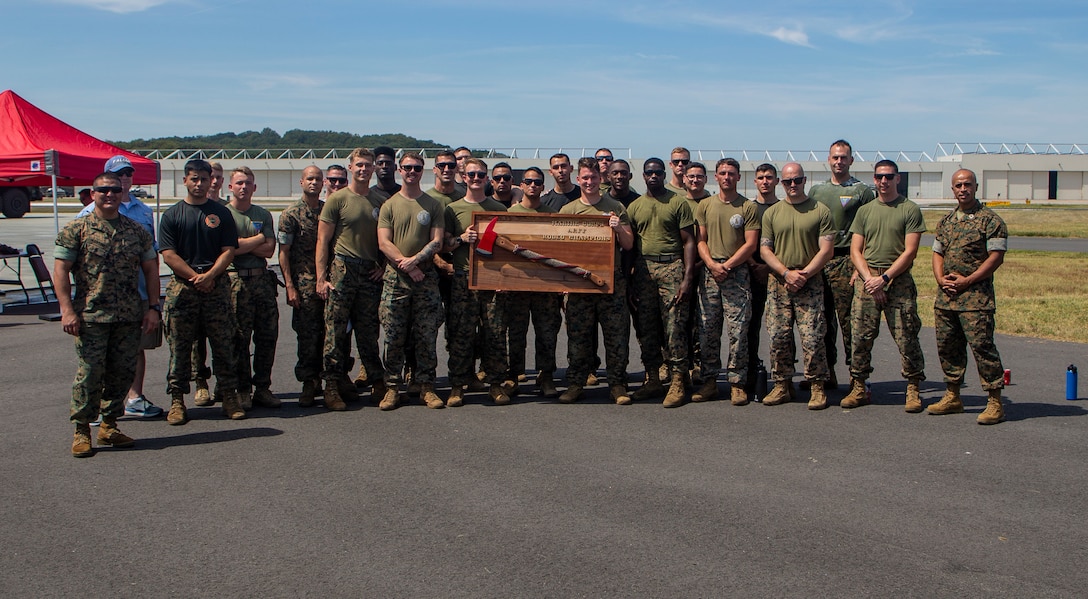 U.S. Marines with Marine Corps Air Facility Quantico and Chemical Biological Incident Response Force from Indian Head, Maryland pose for a group photo during the Aircraft Rescue and Fire Fighter Rodeo at MCAF on Marine Corps Base Quantico, Sep. 2, 2022. The ARFF Rodeo is a competition for Marines to showcase their operational knowledge of firefighting tactics, techniques, and procedures. (U.S. Marine Corps Photo by Lance Cpl. George Nudo)
