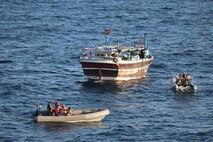 GULF OF ADEN (Nov. 22, 2022) Personnel from guided-missile destroyer USS Nitze (DDG 94) interdict a fishing vessel smuggling illicit narcotics in the Gulf of Aden, Nov. 22.