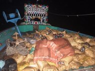 Bags of illicit narcotics sit on the deck of a fishing vessel interdicted by guided-missile destroyer USS Nitze (DDG 94) in the Gulf of Aden, Nov. 22. Nitze seized 2,200 kilograms of hashish and 330 kilograms of methamphetamine as the fishing vessel transited international waters. (U.S. Navy photo)