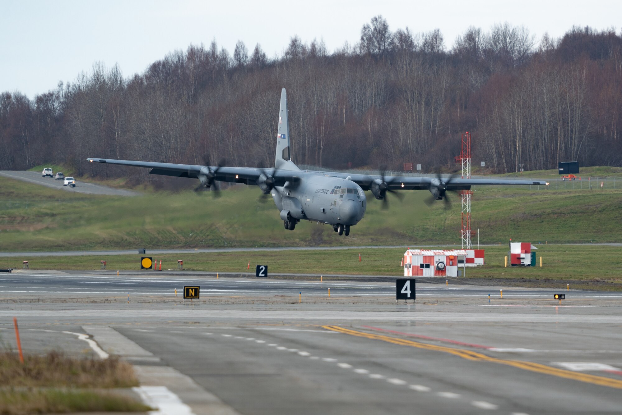 A U.S. Air Force C-130J Super Hercules assigned to the 317th Airlift Wing at Dyess Air Force Base, Texas, prepares to land during RED FLAG-Alaska 23-1 at Joint Base Elmendorf-Richardson, Alaska, Oct. 14, 2022. This exercise provides unique opportunities to integrate various forces into joint, coalition and multilateral training from simulated forward operating bases. (U.S. Air Force photo by Airman 1st Class J. Michael Peña)