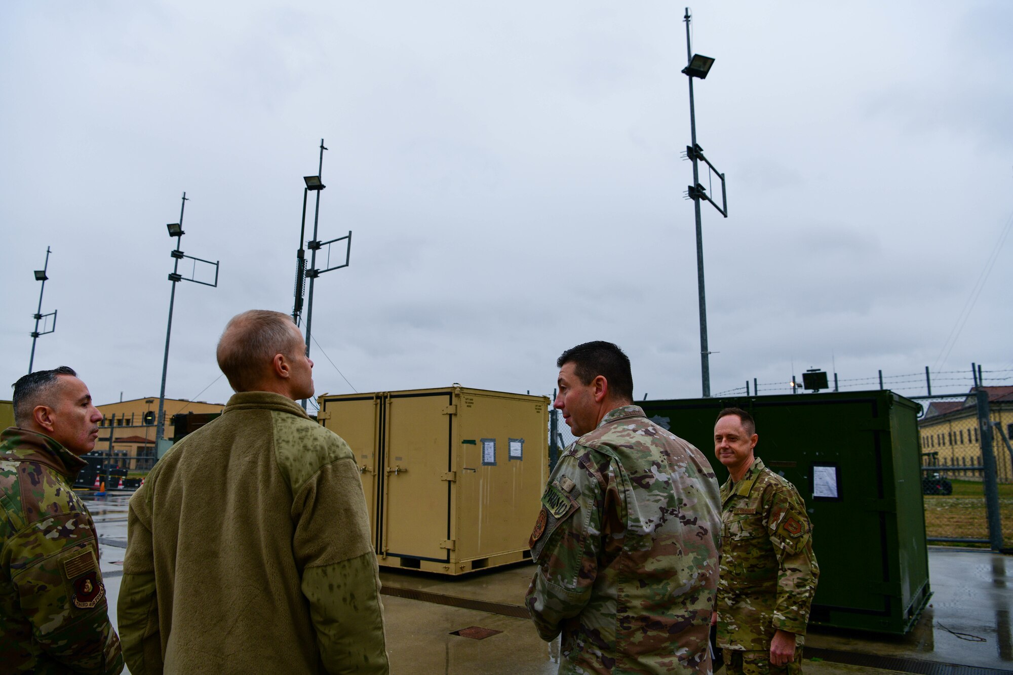 U.S. Air Force Lt. Col. Joseph Faraone, 606th Air Control Squadron commander, middle-right, briefs U.S. Air Force Brig. Gen. Tad Clark, 31st Fighter Wing commander, right, and Third Air Force leadership, left, on 606th ACS equipment and capabilities at Aviano Air Base, Italy, Nov. 22, 2022. This 606th ACS unit is comprised of more than 400 Airmen from 25 diverse Air Force specialty codes and $173M of rapidly deployable equipment including two TPS-75 radars, long-haul communications equipment, generators, tactical vehicles and a computer-based information system providing a real-time battlespace picture. (U.S. Air Force photo by Senior Airman Brooke Moeder)