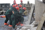 Service members from the Pennsylvania National Guard's 3rd CBRN (Chemical, Biological, Radiological, and Nuclear) Task Force drill through concrete during a Homeland Response Force collective training exercise Nov. 18, 2022, at Fort Indiantown Gap, Pa.