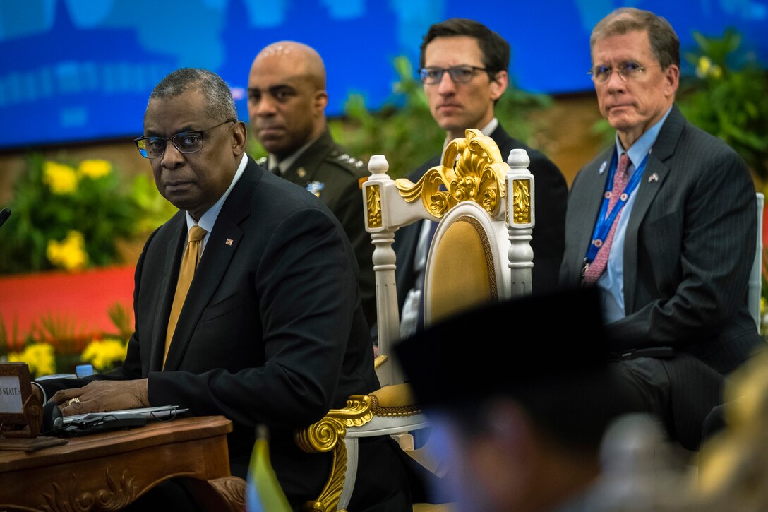 A group of people look at the camera.