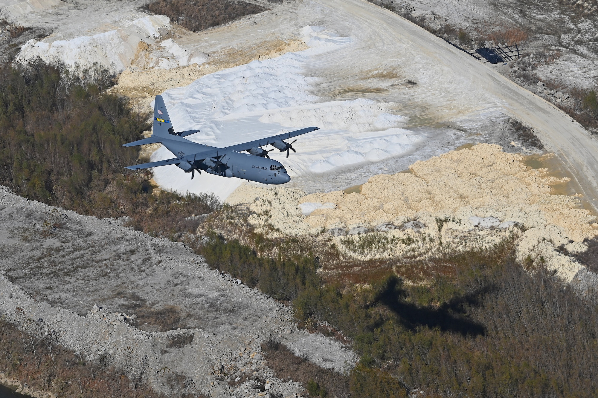 A c-130J flies in the sky over Arkansas