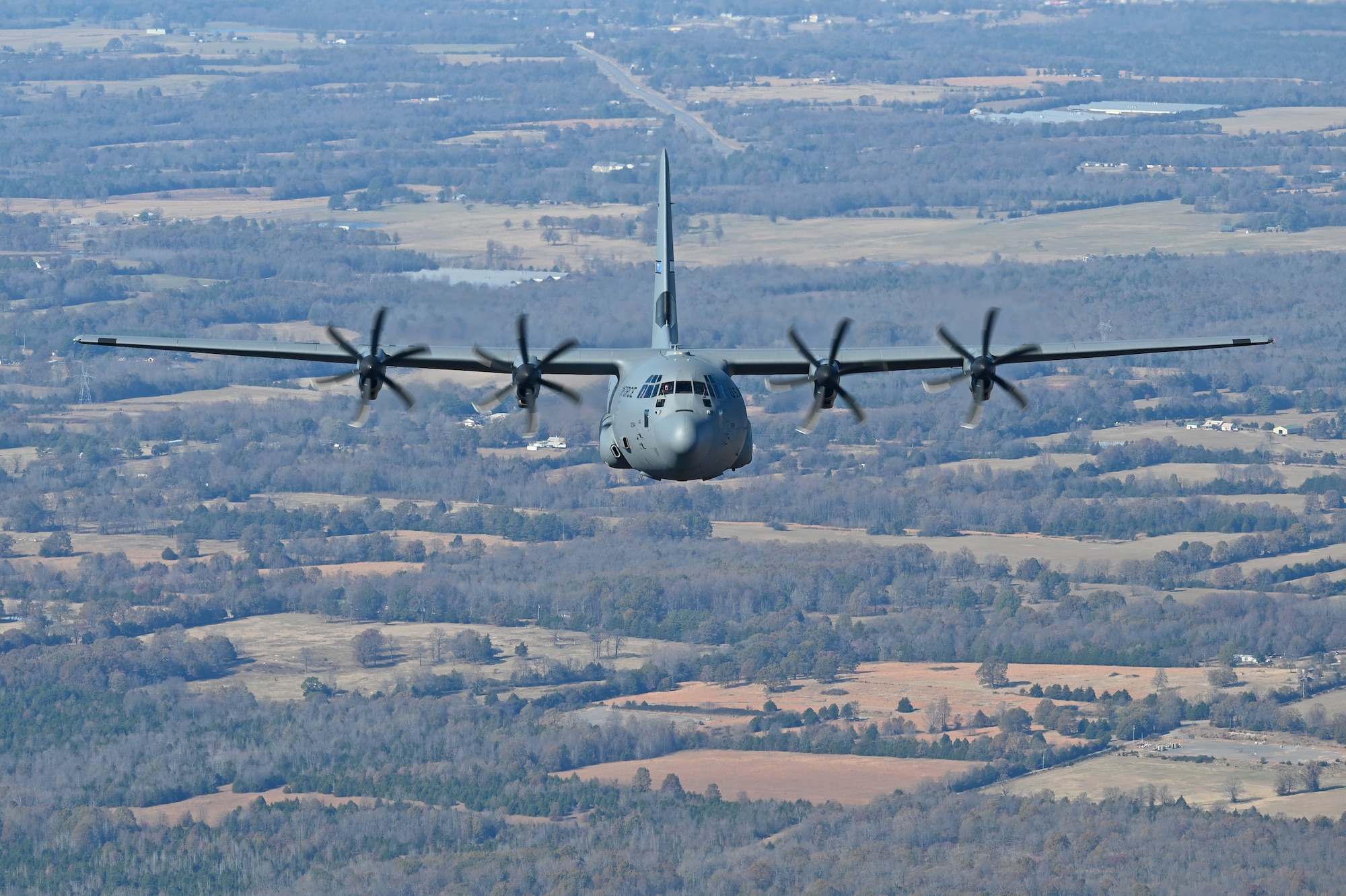 A c-130J flies in the sky over Arkansas