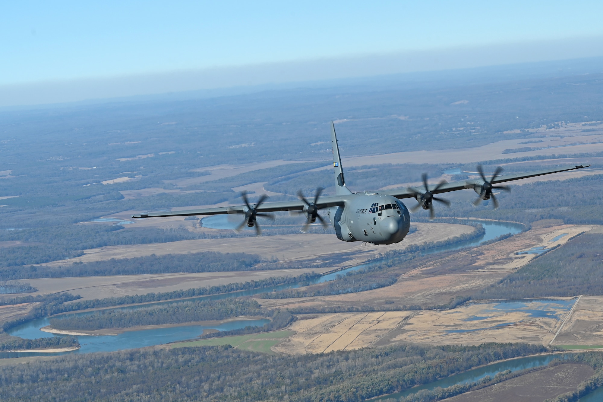 A c-130J flies in the sky over Arkansas