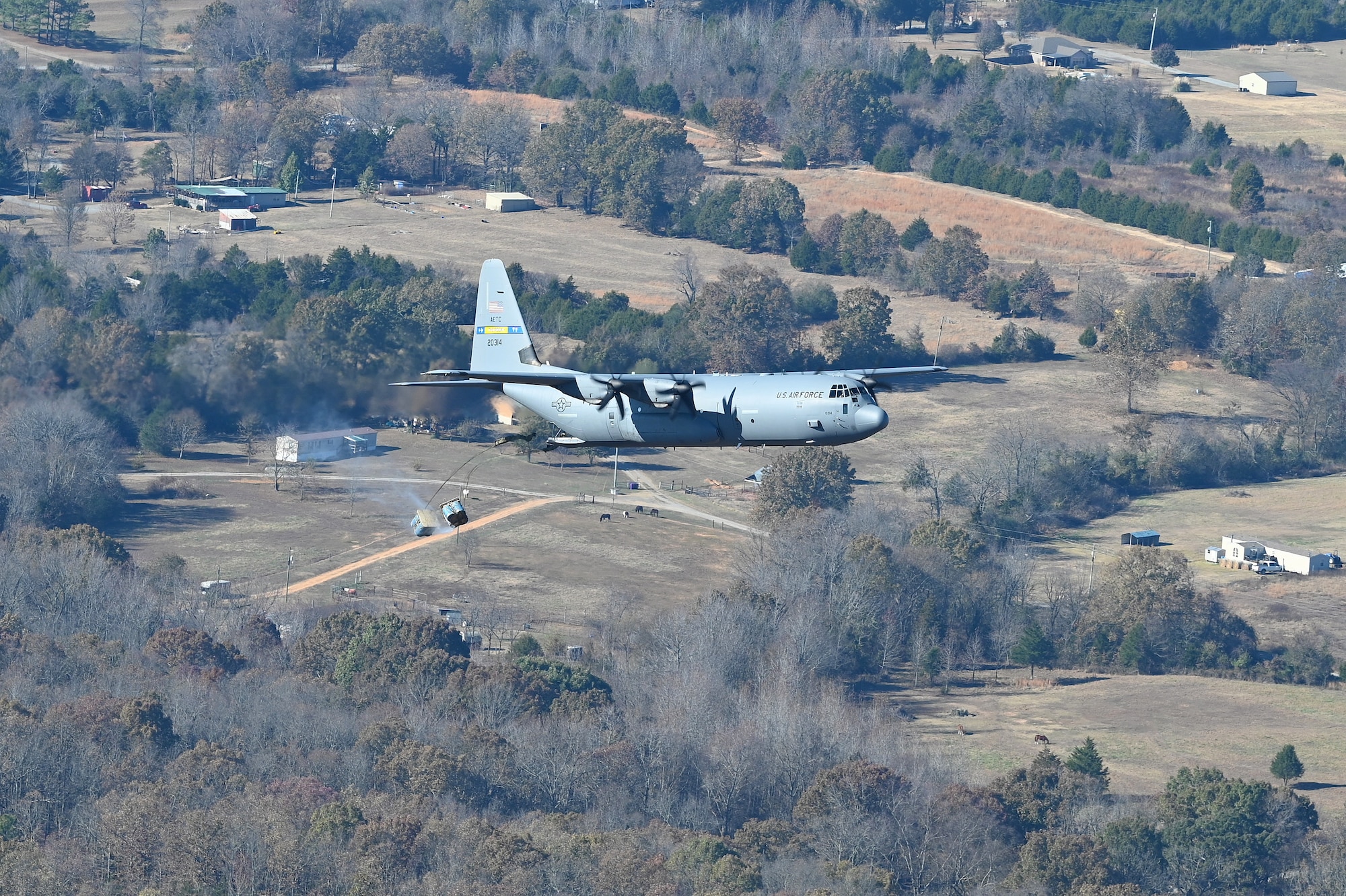 A c-130J flies in the sky over Arkansas