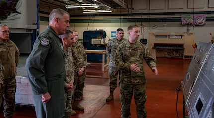 Gen. Mike Minihan listens to an Airman's initiative.