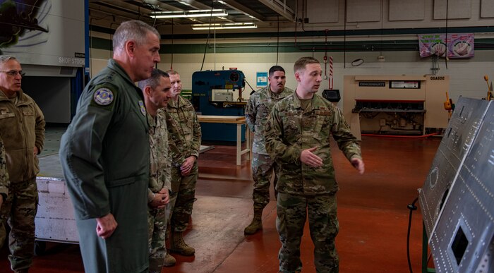 Gen. Mike Minihan listens to an Airman's initiative.