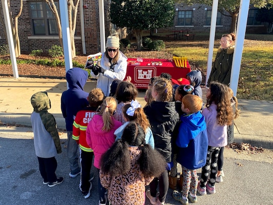 Amanda Sticker, Huntsville Center engineer, and Ellen Haapoja, geophysicist, teach students explosives safety during Columbia Elementary School's "Community Heroes Day" in Madison, Alabama, on Friday, Nov. 18.