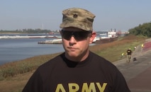 man wearing black shirt with army on the front