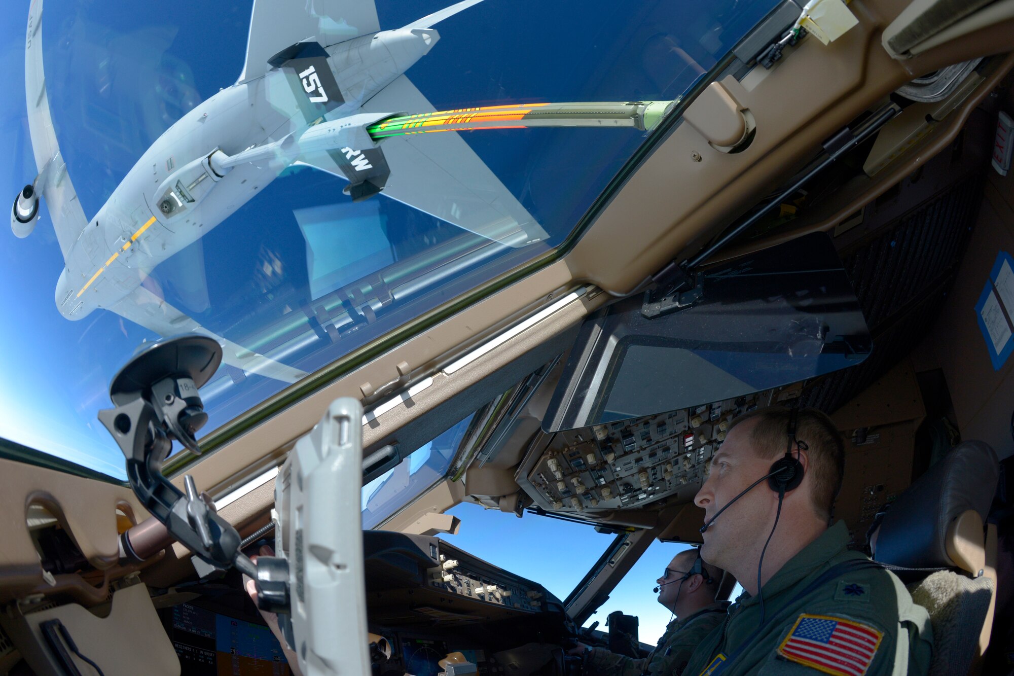 Lt. Col. Greg Van Splunder, Lt. Col. Brandon Stock and Tech. Sgt. Matt Rogers, all of the 157th Air Refueling Wing, Pease Air National Guard Base, New Hampshire Air National Guard, guide their KC-46A Pegasus as it receives fuel from another Pease KC-46A during a 36-hour endurance mission, Nov. 16, 2022. 

Lt. Col. Greg Van Splunder and Lt. Col. Brandon Stock, pilots with the 157th Air Refueling Wing, Pease Air National Guard Base, New Hampshire Air National Guard, guide their KC-46A Pegasus as it receives fuel from another Pease KC-46A during a 36-hour endurance mission, Nov. 16, 2022. 

The long-duration sortie took place from Nov. 16-17 and was crewed by active duty and Air National Guard Airmen from Pease, who flew the jet non-stop from New Hampshire, across North America and the Pacific Ocean, around Guam, and back home again. The proof-of-concept operation showcased the ability of the Air Force’s newest tanker to project the force in the modern battle space. (U.S. Air National Guard photo by Senior Master Sgt. Timm Huffman)