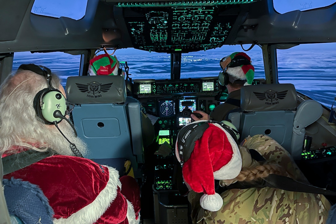 Santa Claus flies in an aircraft with three soldiers in uniform.