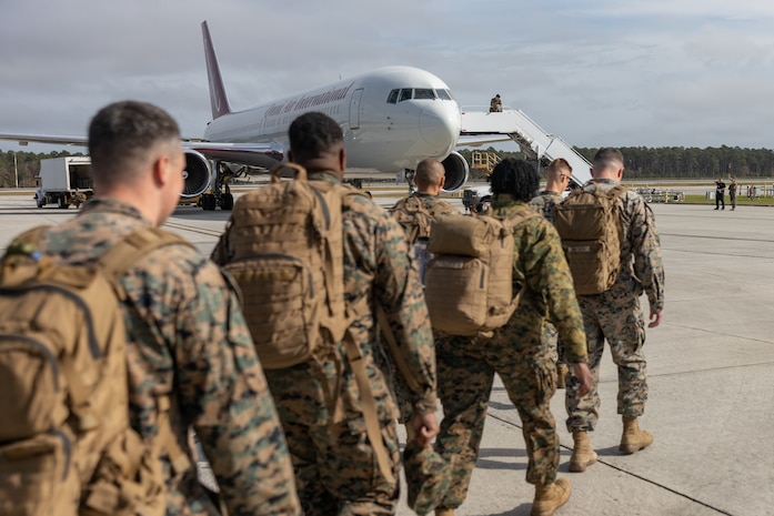 U.S. Marines assigned to II Marine Expeditionary Force (MEF) wave to onlookers ashore from aboard the Spearhead-class expeditionary fast transport USNS Trenton (T-EPF 5) in Koper, Slovenia, Nov. 16, 2022. Marines assigned to II MEF, based out of Camp Lejeune, North Carolina, embarked aboard USNS Trenton (T-EPF 5) to improve interoperability while refining the U.S. capability to rapidly deploy forces aboard U.S. Navy expeditionary fast transport vessels. (U.S. Marine Corps photo by Sgt. Scott Jenkins)