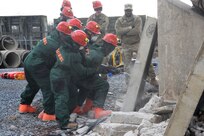 Service members from the Pennsylvania National Guard's 3rd CBRN (Chemical, Biological, Radiological, and Nuclear) Task Force drill through concrete during a Homeland Response Force collective training exercise Nov. 18, 2022, at Fort Indiantown Gap, Pa.