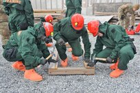Service members from the Pennsylvania National Guard's 3rd CBRN (Chemical, Biological, Radiological, and Nuclear) Task Force practice shoring unstable objects during a Homeland Response Force collective training exercise Nov. 18, 2022, at Fort Indiantown Gap, Pa.
