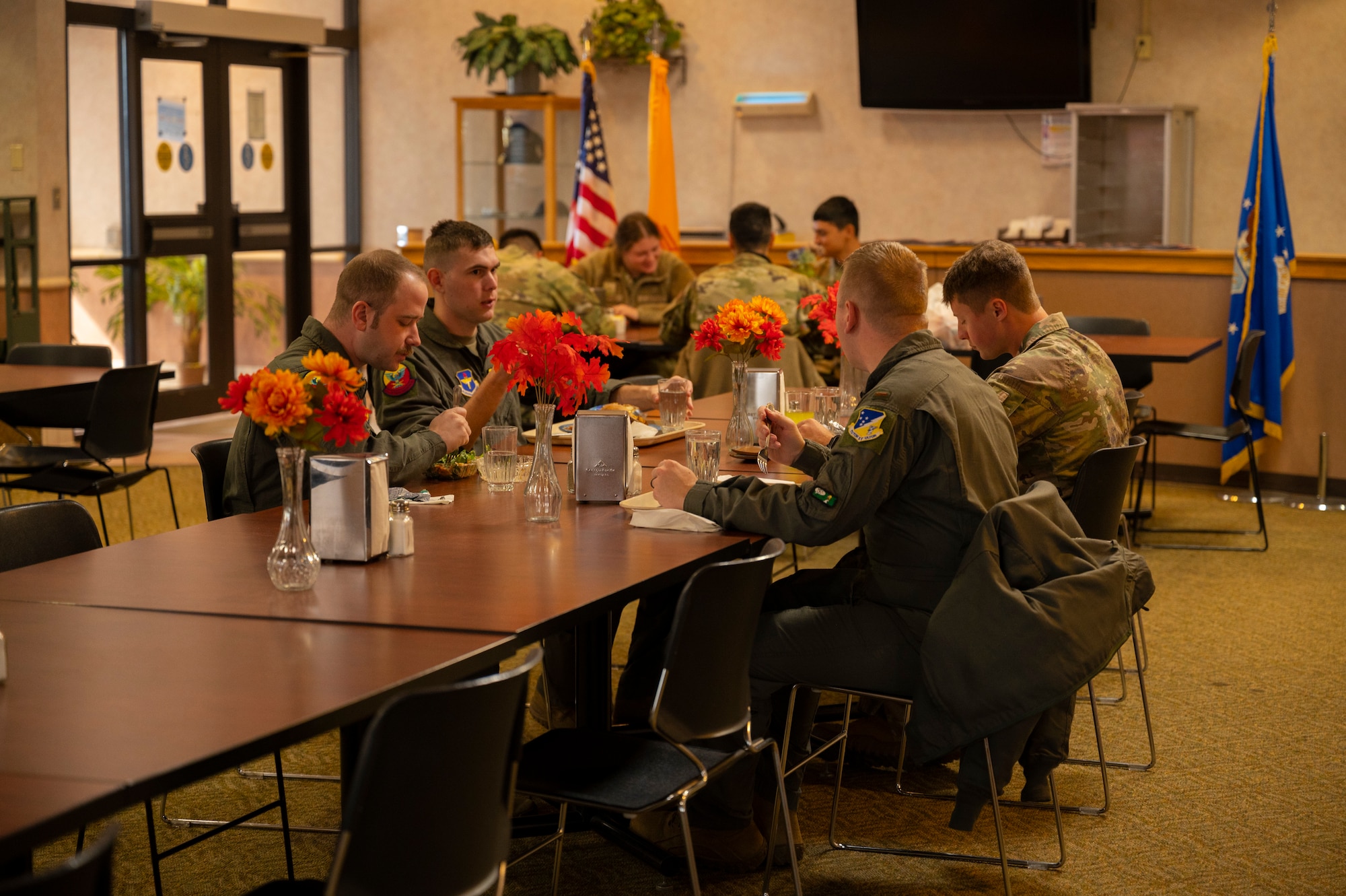 Airmen eat lunch at the Shifting Sands Dining Facility at Holloman Air Force Base, New Mexico, Nov. 18, 2022. The dining facility is a staple on all Air Force bases and is responsible for providing nutrition that is essential to an Airman's readiness. (U.S. Air Force photo by Airman 1st Class Isaiah Pedrazzini)