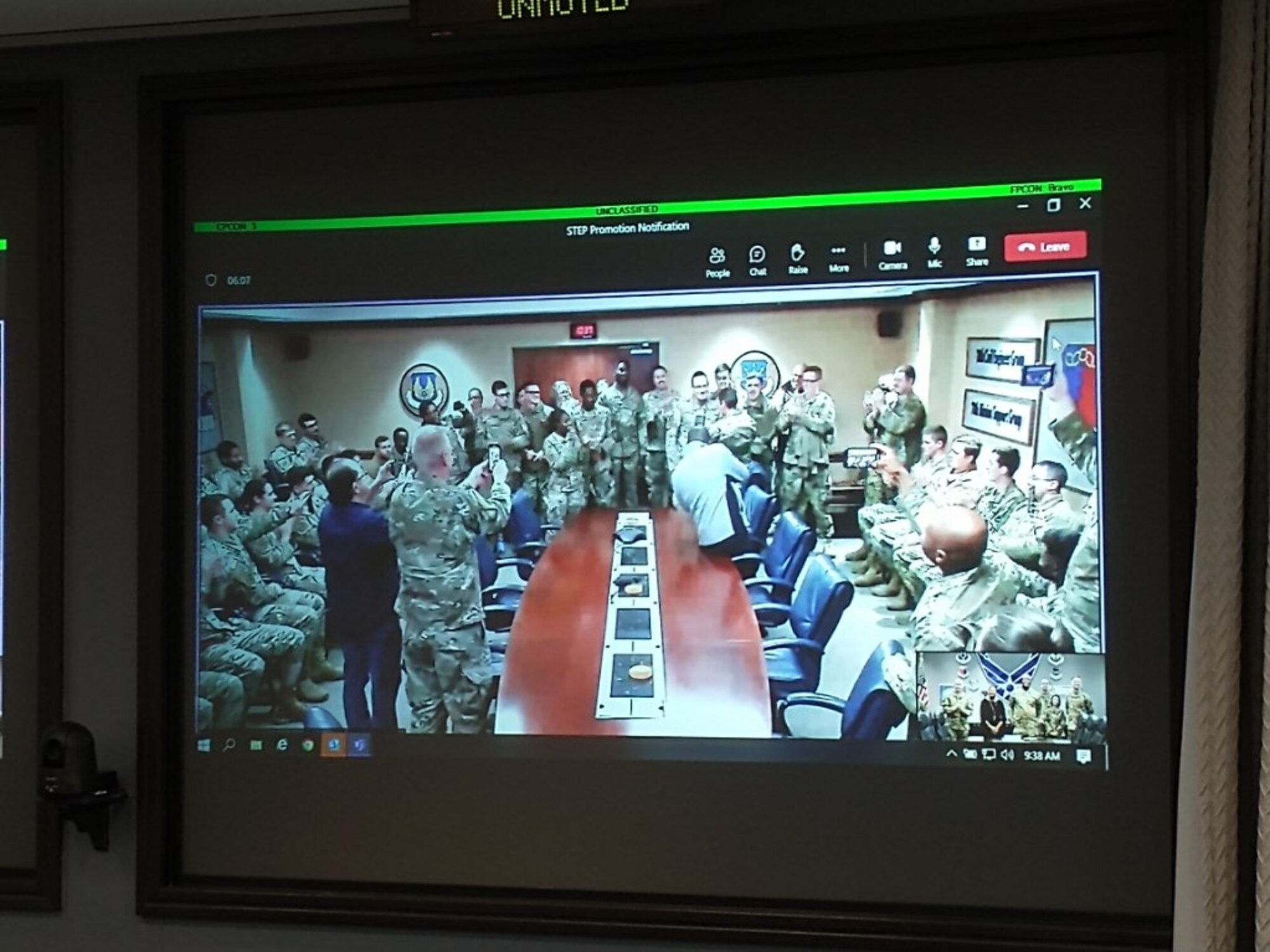 Members at Robins AFB watch as Air Force Sustainment Center Commander, Lt. Gen. Stacey T. Hawkins promoted two 78th Logistics Readiness Squadron members via video teleconference from Tinker AFB, Oklahoma.