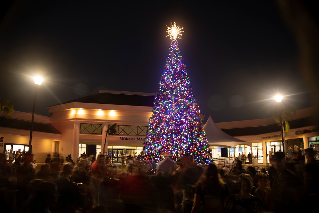 Residents of Marine Corps Base Hawaii attend the 2022 Tree Lighting Ceremony at the Mokapu Mall, Marine Corps Base Hawaii, Nov. 22, 2022. The annual tree lighting ceremony is an opportunity for MCBH families to come together in celebration of the start of the holiday season. (U.S. Marine Corps photo by Staff Sgt. Jordan E. Gilbert)