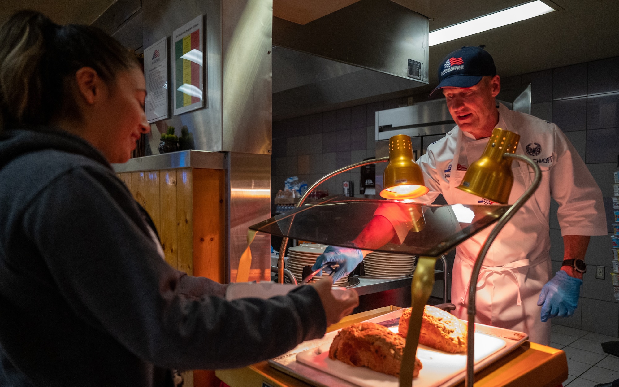 U.S. Air Force Brig. Gen. Jason Rueschhoff, 56th Fighter Wing commander, serves turkey to Airmen