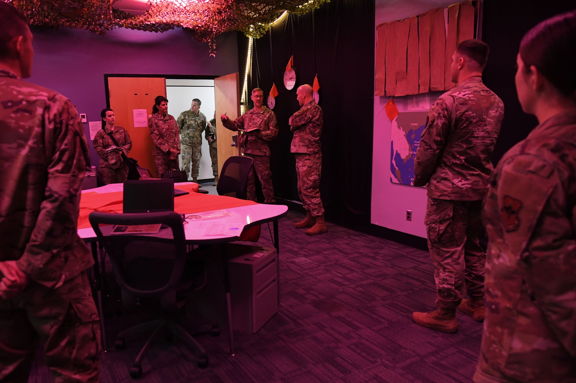 U.S. Air Force Lt. Col. Nicholas Kuc, 333rd Training Squadron commander, provides an overview of the cyber warfare training capabilities inside the 333rd TRS escape room to Gen. David Allvin, Vice Chief of Staff of the Air Force, inside Stennis Hall at Keesler Air Force Base, Mississippi, Nov. 18, 2022.