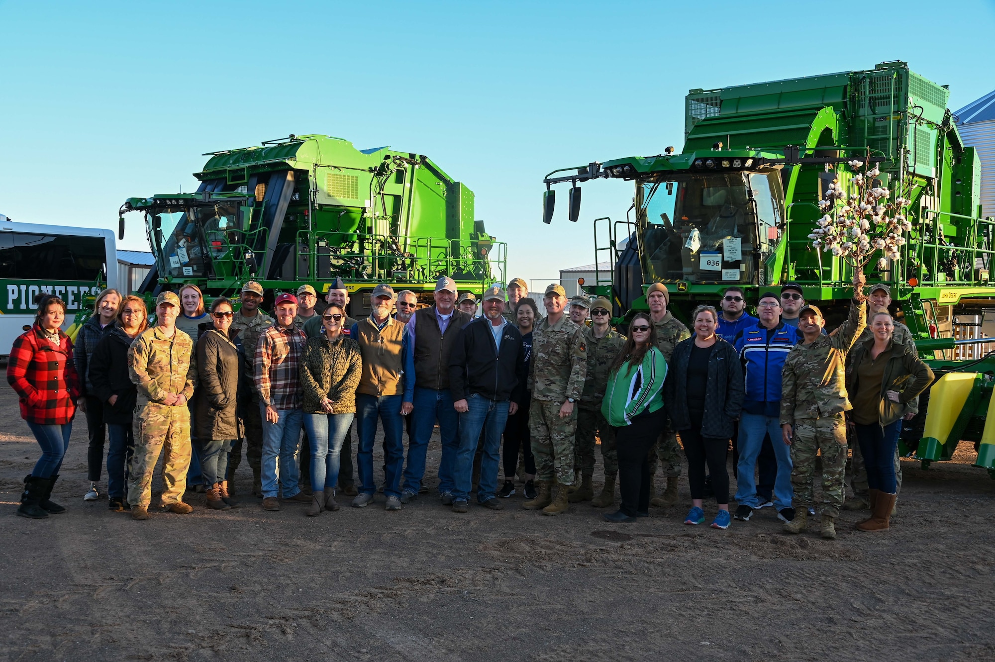 Airmen from the 97th Air Mobility Wing pose for a photo with the City of Altus and local community members during Farm City Week in Altus, Oklahoma, Nov. 17, 2022. Every year during Farm City Week, Airmen from Altus Air Force Base and members of Altus’ agricultural community take time to strengthen their relationship by learning more about each other’s mission and role in the community (U.S. Air Force photo by Senior Airman Kayla Christenson)