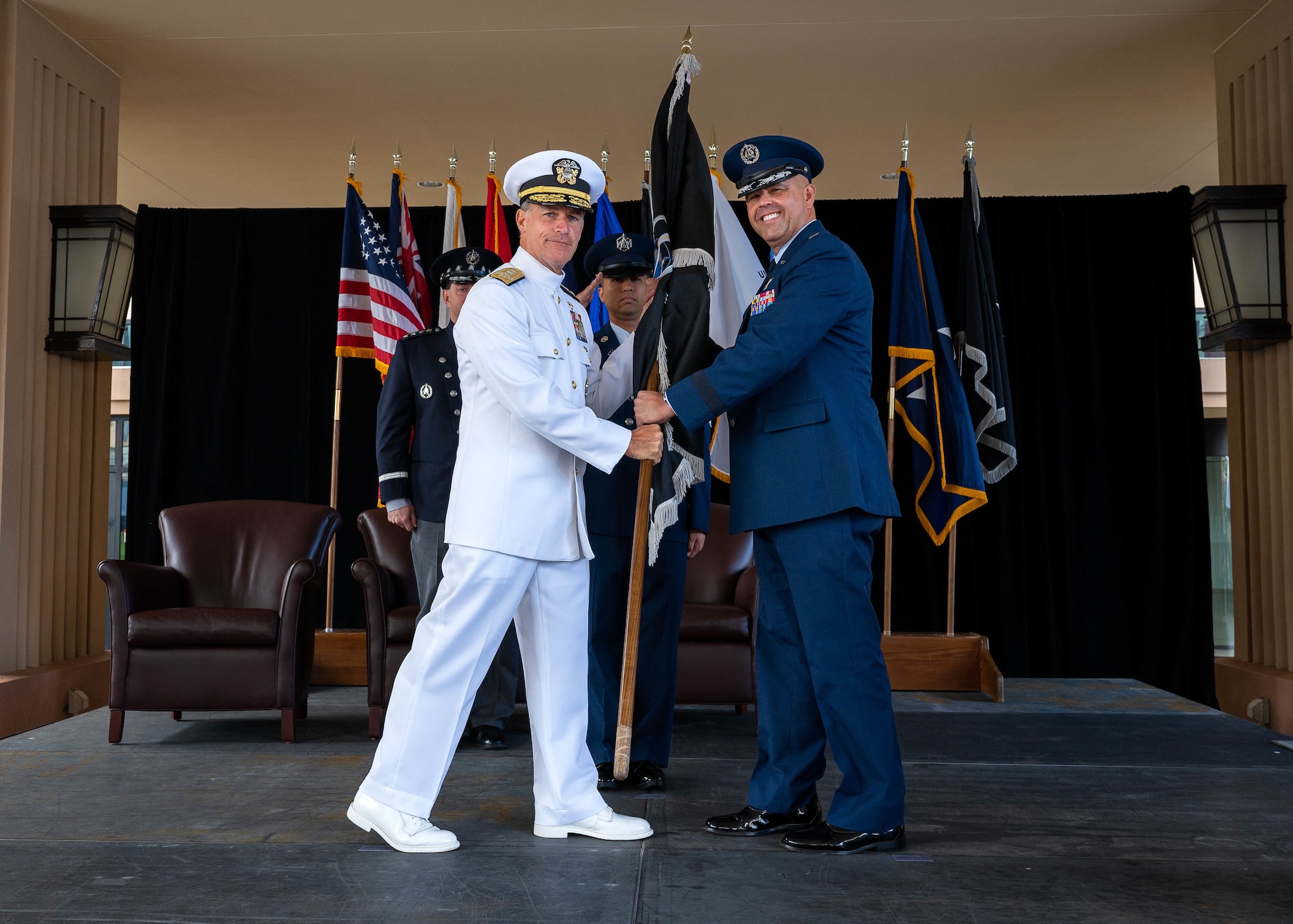 Adm. John C. Aquilino, Commander of U.S. Indo-Pacific Command, left, passes the United States Space Forces, Indo-Pacific, command flag to Brig. Gen. Anthony J. Mastalir, Commander of USSPACEFORINDOPAC, officiating his assumption of command during the USSPACEFORINDOPAC activation ceremony hosted by USINDOPACOM. USSPACEFORINDOPAC will serve as the space-domain authority to USINDOPACOM, advancing the capabilities of the joint force and promoting a free and open Indo-Pacific. (U.S. Navy photo by Mass Communication Specialist 1st Class Anthony J. Rivera)