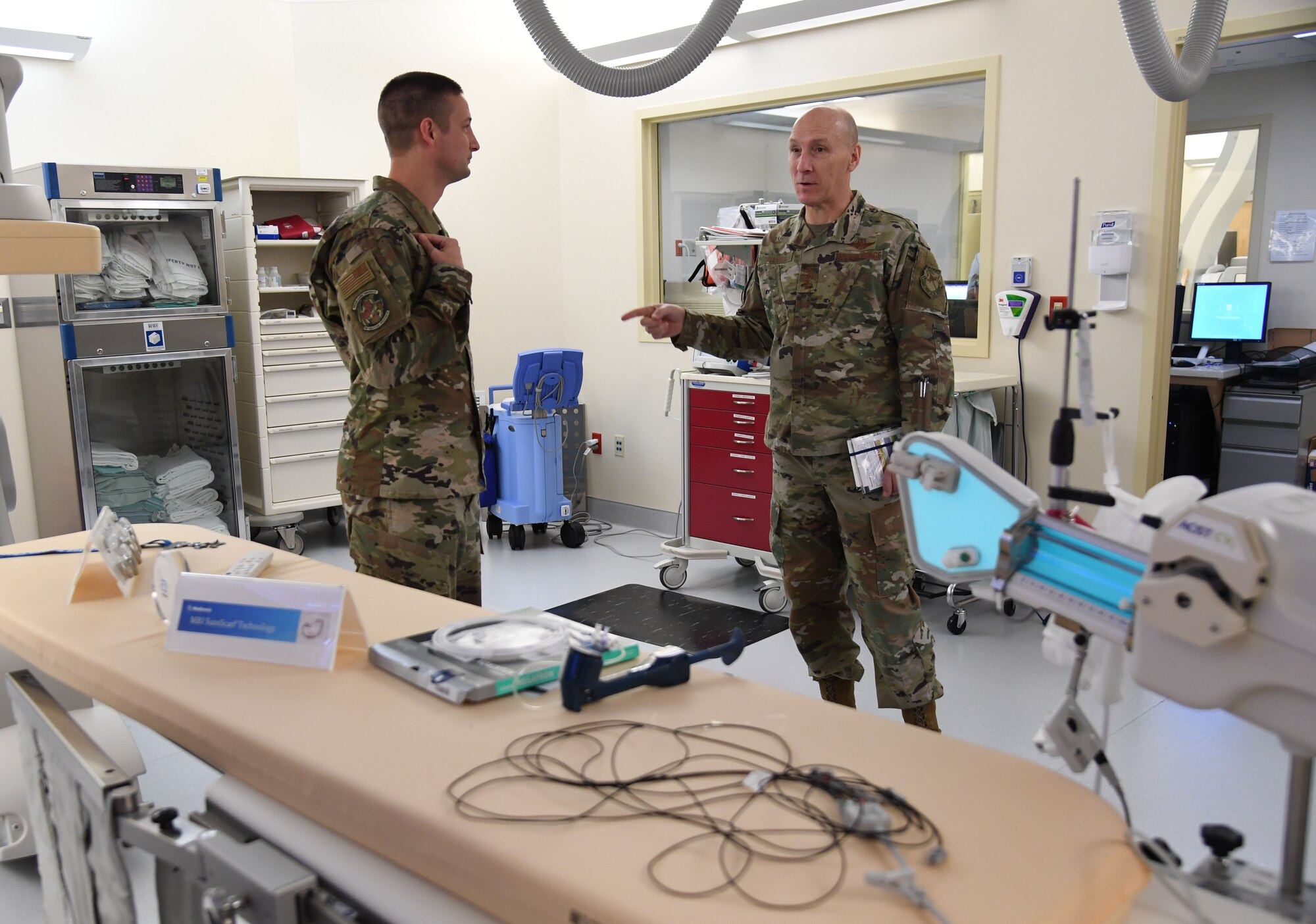 U.S. Air Force Gen. David Allvin, Vice Chief of Staff of the Air Force, and Lt. Col. Frank Russo, 81st Healthcare Operations Squadron interventional cardiologist, discuss the cardiac catheterization lab capabilities inside the Keesler Medical Center at Keesler Air Force Base, Mississippi, Nov. 18, 2022.