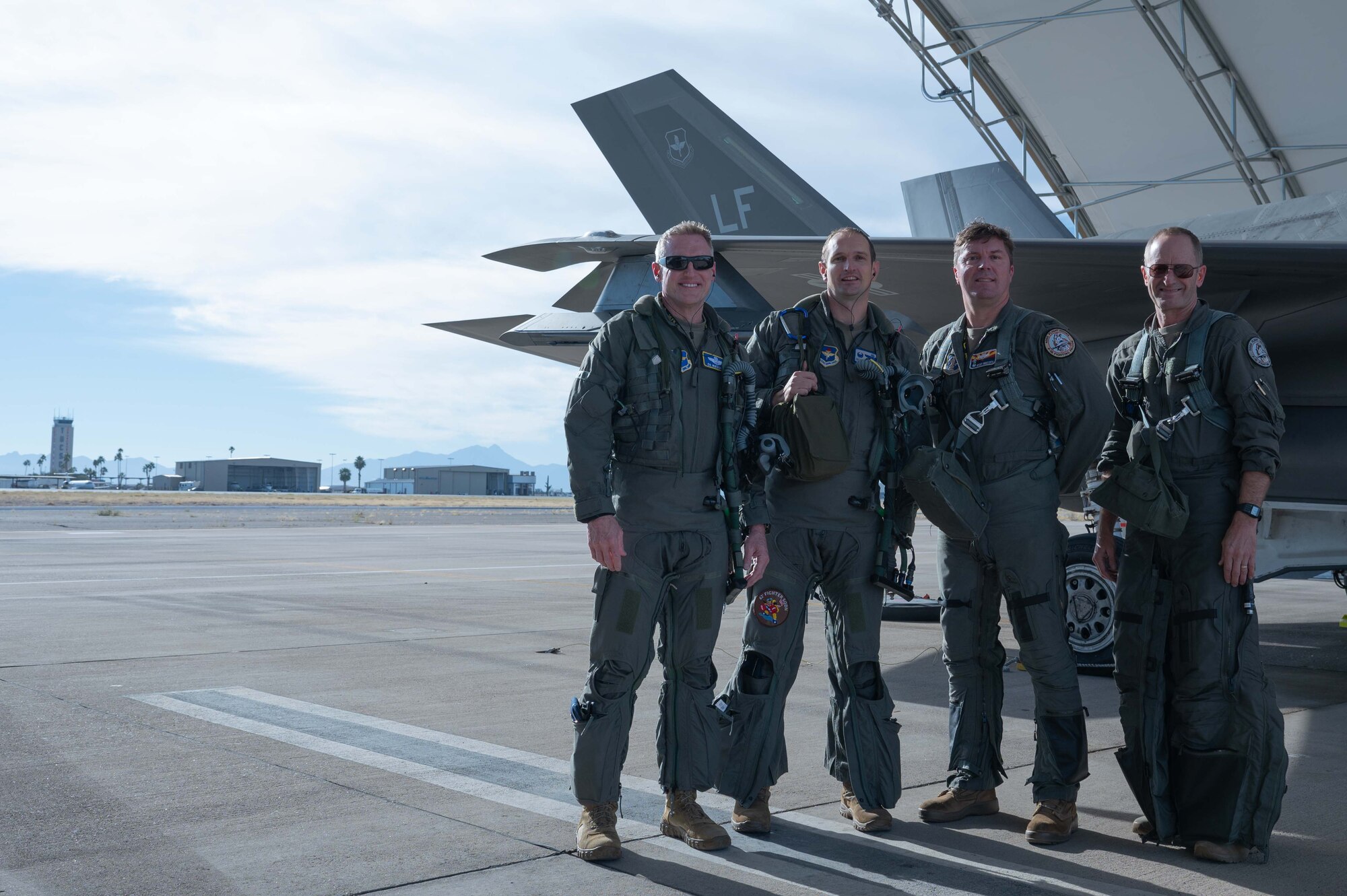 From left, Brig. Gen. Jason M. Rueschhoff, 56th Fighter Wing commander, and Colonel Matthew R. Johnston, 56th Operations Group commander, flew into town to meet up with Thomas A. Obrochta, 162nd Operations Group commander, and Brig. Gen. Jeffrey L. Butler, 162nd Wing commander. The four met in shared airspace to conduct a training event prior to landing at the Morris Air National Guard Base for an in-person meeting.  (U.S. Air National Guard photo by Maj. Angela Walz)