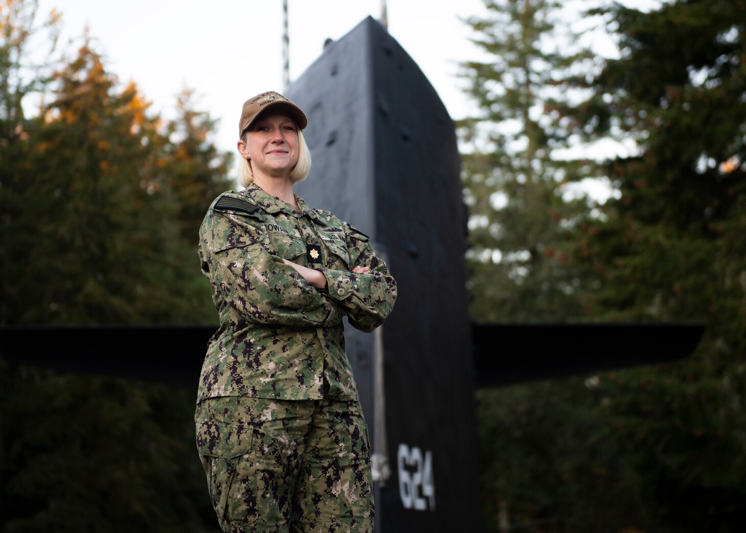 Lt. Cmdr. Amber Cowan, the executive officer of the gold crew of the Ohio-class ballistic-missile submarine USS Kentucky (SSBN 737), from Colorado Springs, Colorado, poses for a portrait at Deterrent Park onboard Naval Base Kitsap – Bangor, November 18, 2022.