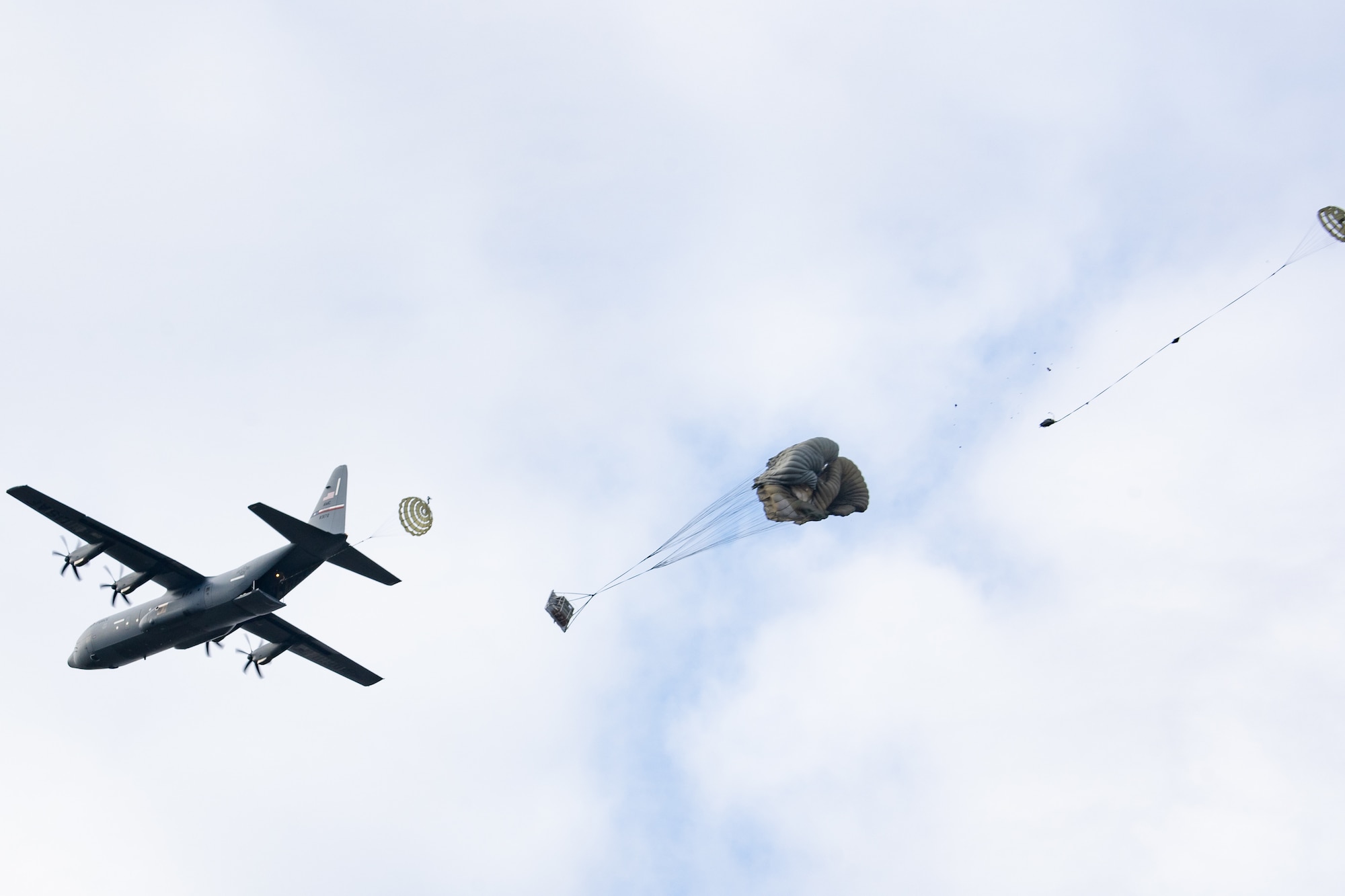 A U.S. Air Force C-130J Super Hercules assigned to the 317th Airlift Wing, Dyess Air Force Base, Texas, conducts cargo drop training during RED FLAG-Alaska 23-1, at Malemute Drop Zone on Joint Base Elmendorf-Richardson, Alaska, Oct. 19, 2022. RF-A 23-1 provides an opportunity for international engagement and training in an environment different from many unit’s home base. (U.S. Air Force photo by Airman 1st Class Julia Lebens)