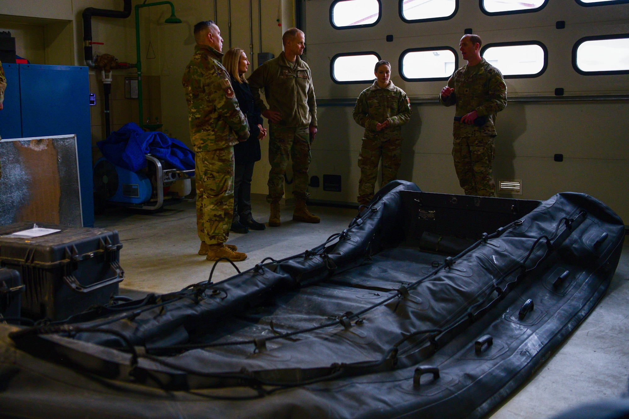 U.S. Air Force Staff Sgt. Katelyn Ramsey, 57th Rescue Squadron aviation resource management NCOIC, middle, and U.S. Air Force Lt. Col. Francis Hallada, 57th Rescue Squadron commander, right, brief Third Air Force leadership at Aviano Air Base, Italy, Nov. 22, 2022. The 57th RQS provides personnel recovery, combat search and rescue, civil search and rescue and casualty evacuation subject matter experts to fulfill USEUCOM, USAFRICOM and NATO security cooperation requirements. (U.S. Air Force photo by Senior Airman Brooke Moeder)