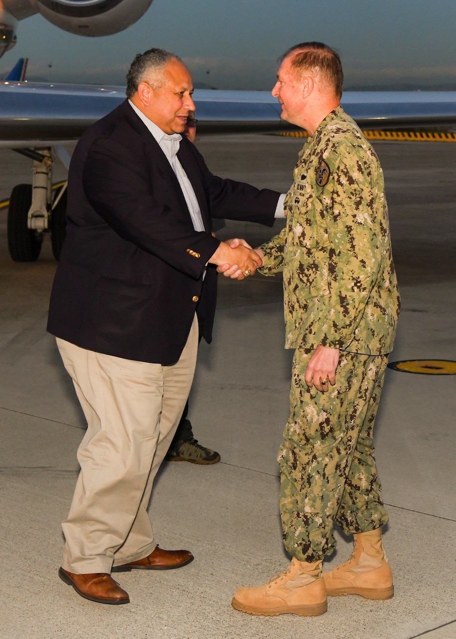 Adm. Stuart Munsch, commander, U.S. Naval Forces Europe-Africa and commander, Allied Joint Force Command Naples, right, greets the Honorable Carlos Del Toro, Secretary of the Navy, as Del Toro arrives onboard Naval Support Activity Naples, Italy for a scheduled visit to U.S. Naval Forces Europe and Africa and U.S. Sixth Fleet (NAVEUR/NAVAF/SIXHFLT) headquarters, Nov. 21, 2022. NAVEUR-NAVAF operates U.S. naval forces in the U.S. European Command (USEUCOM) and U.S. Africa Command (USAFRICOM) areas of responsibility. U.S. Sixth Fleet is permanently assigned to NAVEUR-NAVAF, and employs maritime forces through the full spectrum of joint and naval operations. (U.S. Navy photo by Mass Communication Specialist 2nd Class Cameron Edy)