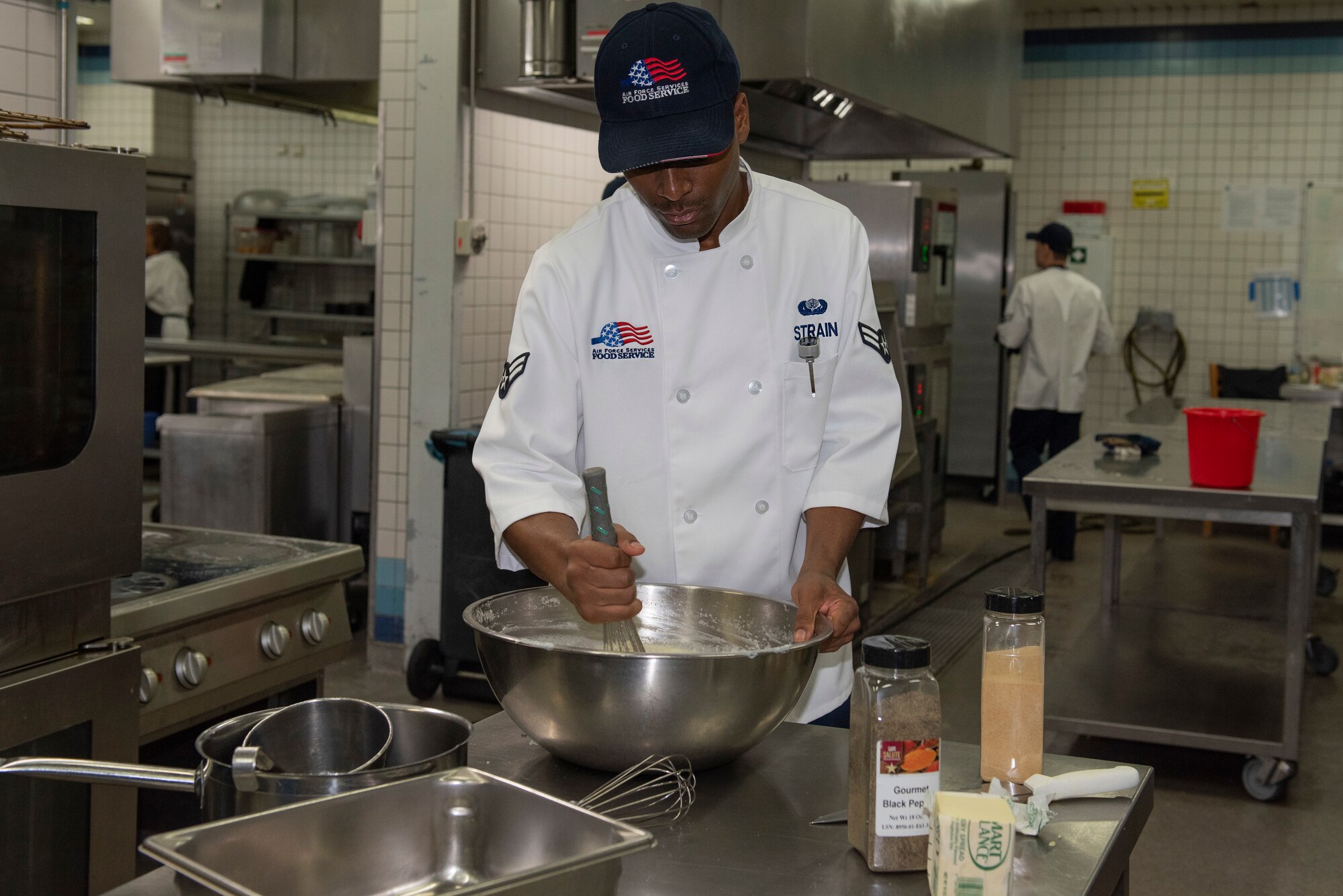 man stirs mashed potatoes