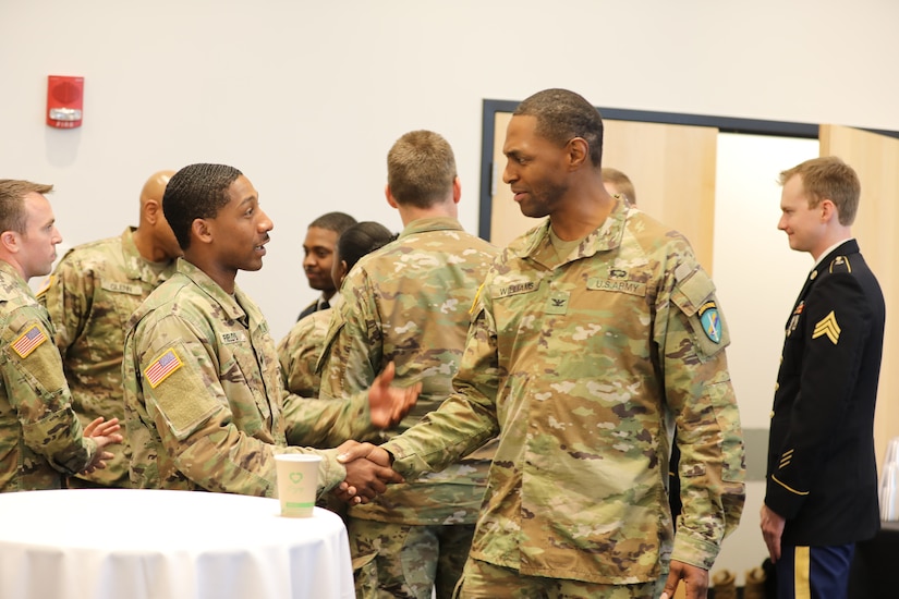 Soldiers of 2nd Psychological Operations Group congratulate and welcome incoming commander Col. Lawrence E. Williams who took command of the group on November 5, 2022, at the Pro Football Hall of Fame in Canton, OH. (US Army Photo Sgt. First Class Kevin Rayan)