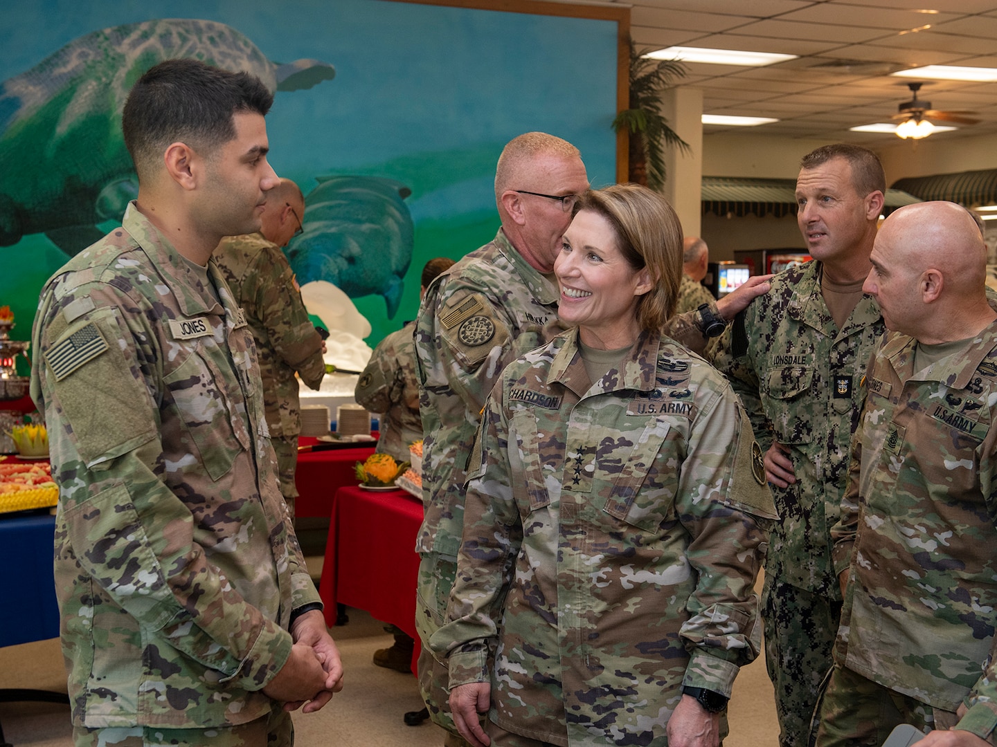 Gen. Laura Richardson, commander, U.S. Southern Command, center, speaks with service members during a Thanksgiving lunch at U.S. Naval Station Guantanamo Bay, Cuba, Nov. 24, 2022.