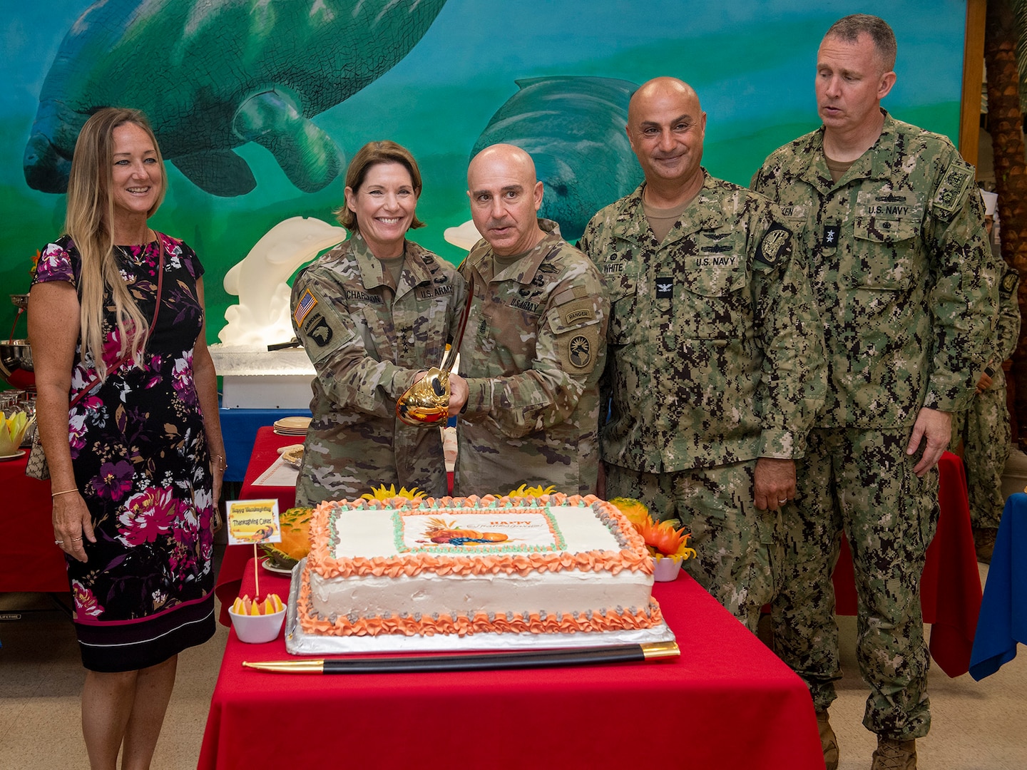 Gen. Laura Richardson, commander, U.S. Southern Command, and Command Sgt. Maj. Benjamin Jones, pose for a cake cutting during a Thanksgiving lunch for service members at U.S. Naval Station Guantanamo Bay, Cuba, Nov. 24, 2022.